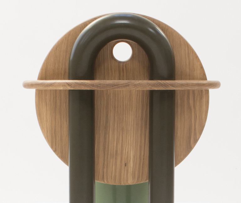 Looped steel back leg passing behind the backrest