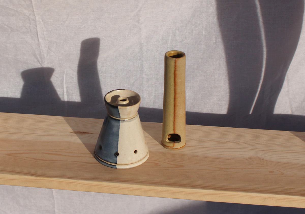 Didcot and Dibnah on a pine shelf with long shadows