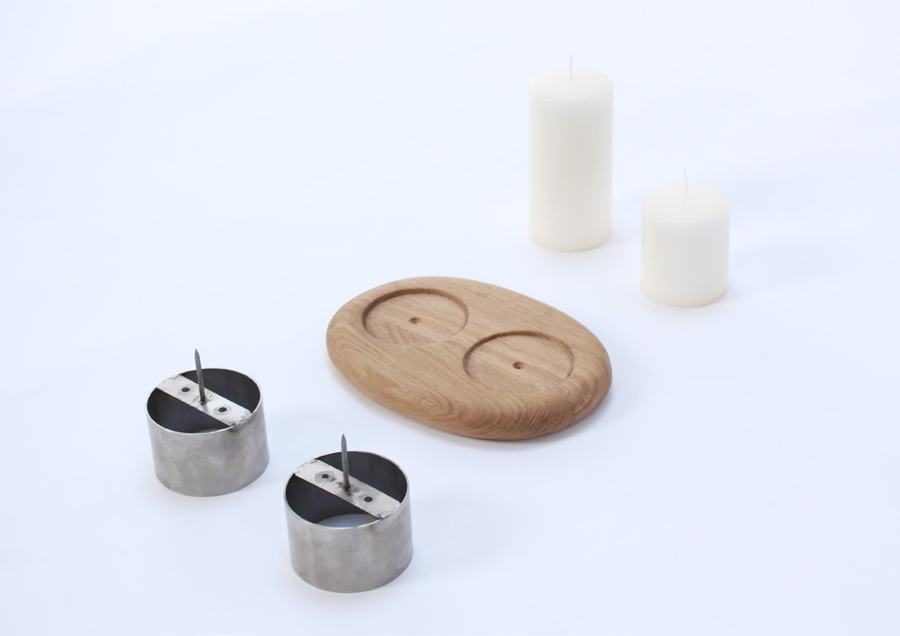 Exploded view: oak base, steel legs and candles