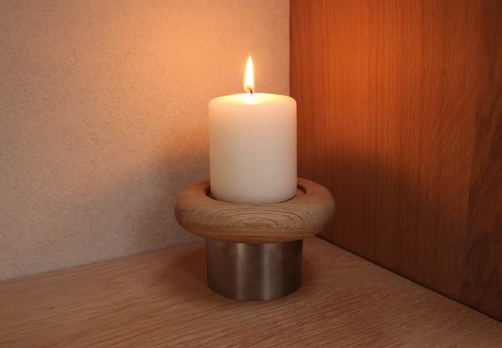 Single holder lit in a warm corner